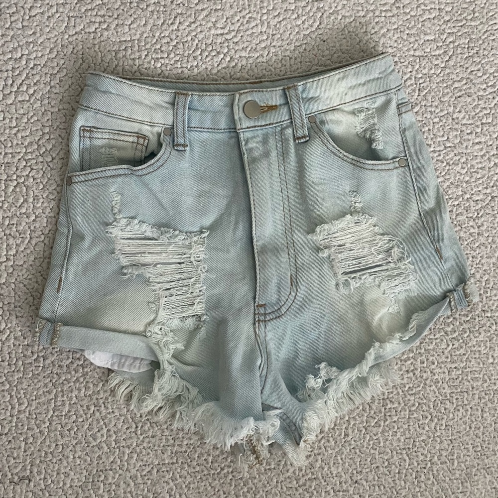 High waisted light wash ripped jeans short